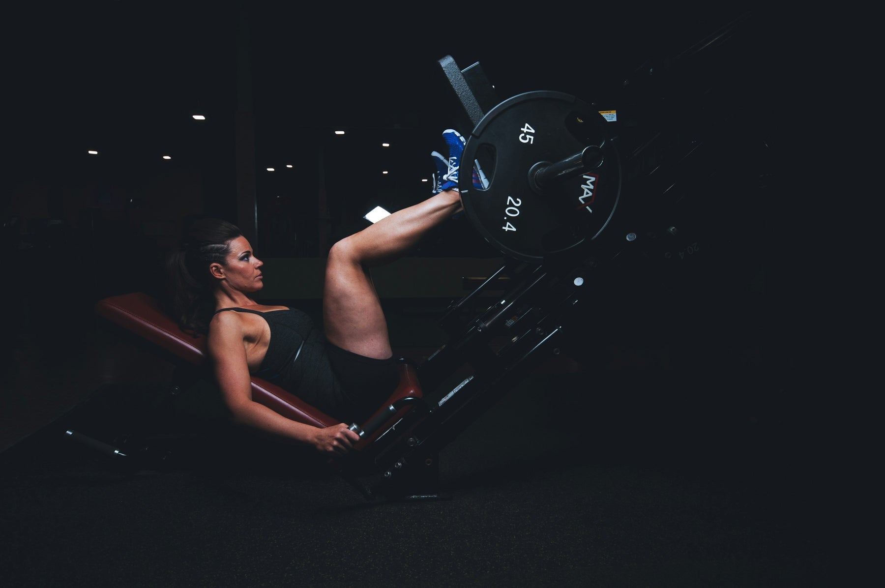 How To Use a Leg Press Machine: Form, Foot Placement & Tips