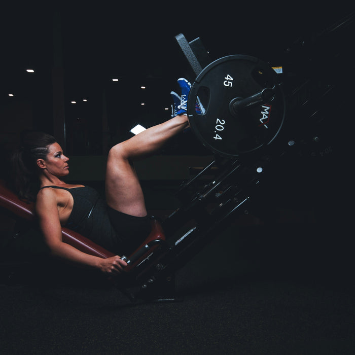 How To Use a Leg Press Machine: Form, Foot Placement & Tips