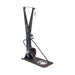 The Bells of Steel Blitz Ski Trainer is a black machine with a fan flywheel, monitor, and dual handles on a platform with a white logo—ideal for full-body workouts or simulating cross-country skiing indoors.