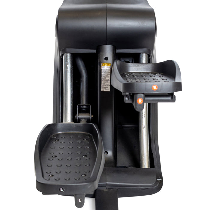 Close-up of the Bells of Steel Blitz Stepper's black foot pedals, labeled "L" and "R," featuring textured grip and sturdy metal bars—perfect for low-impact cardio workouts.
